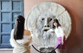 Beautiful asian women photograph each other in front of the mouth of truth Bocca della Verit Royalty Free Stock Photo